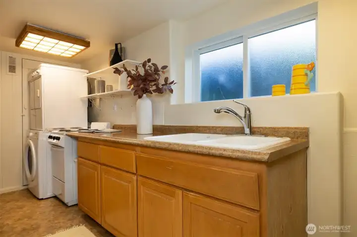 Second kitchen and laundry in the basement.