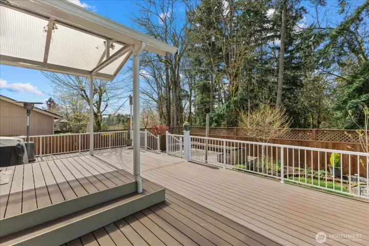 Durable AZEK deck with awning for year-round enjoyment