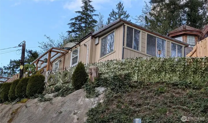 This corner view is the enclosed sunroom, which is also used as a bedroom.