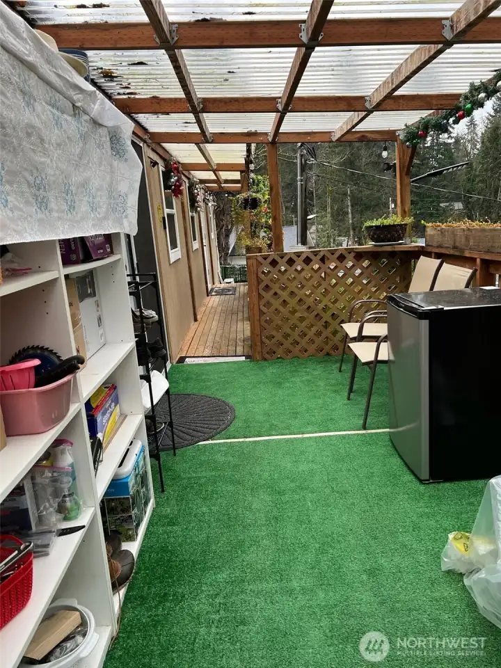 Front deck has room for storage, a BBQ, and is under cover for inclimate weather.