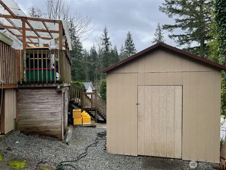 Three storage areas, one to the very left, another under the deck and one behind the carport.