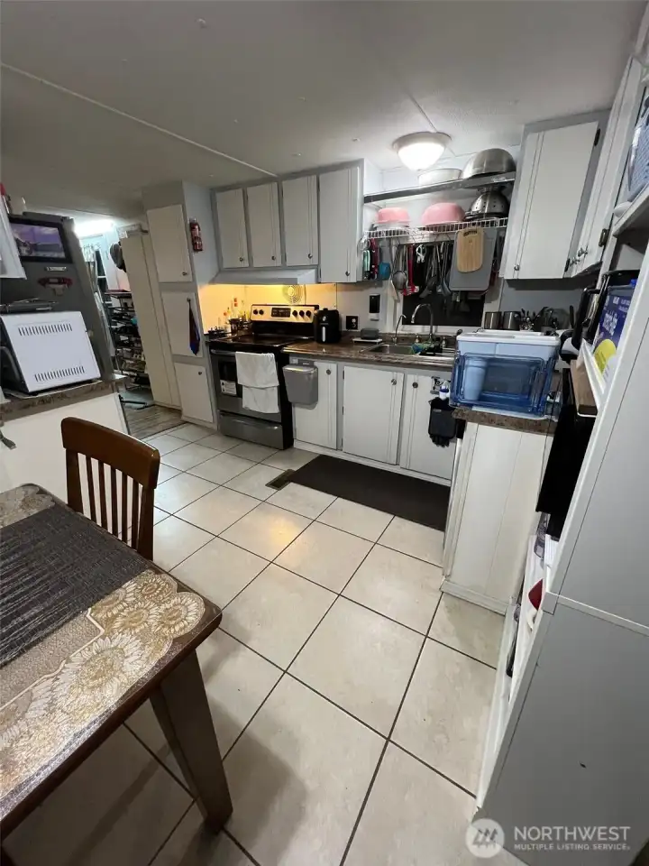 Updated tile floors in the kitchen. All appliances stay.