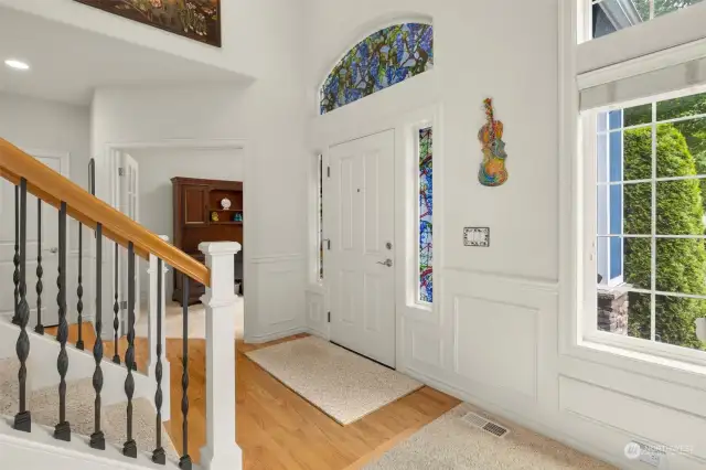 Light-filled entry with beautiful glass outlining door
