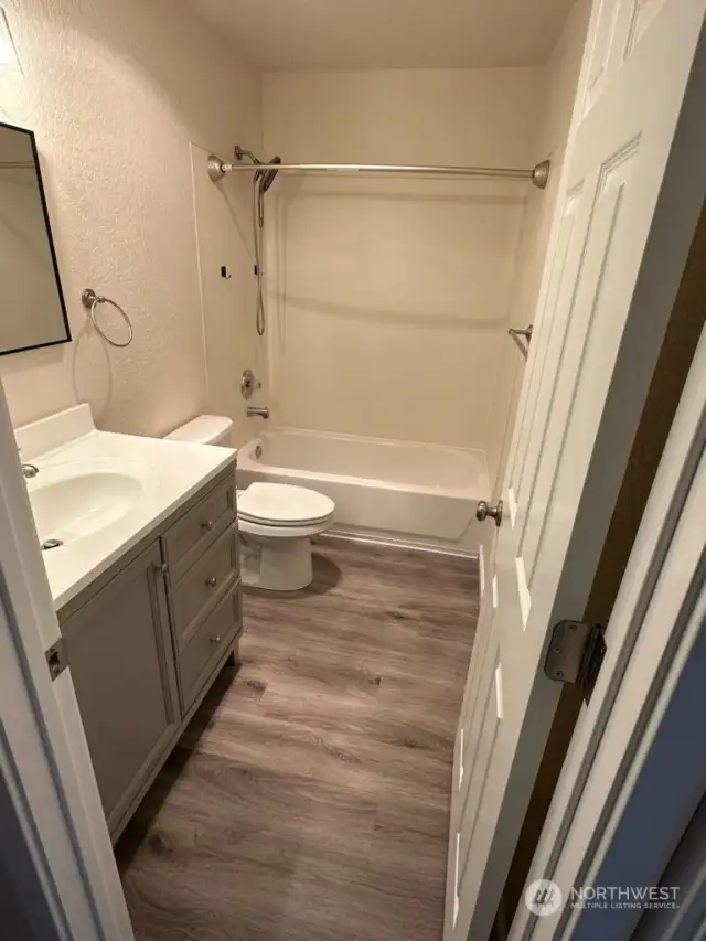 Bathroom with tub/shower combo.