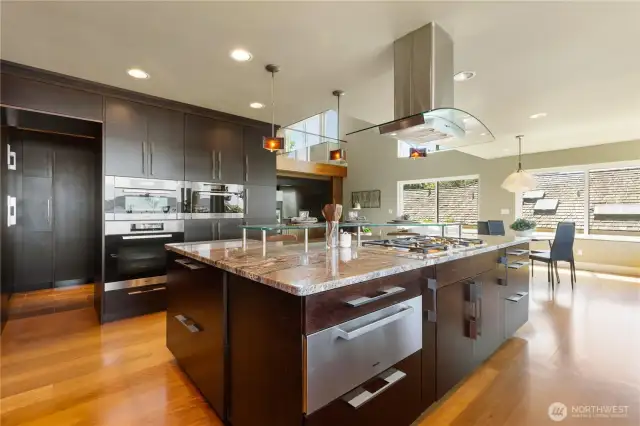 Note th granite counters and custom glass counter for breakfast bar.