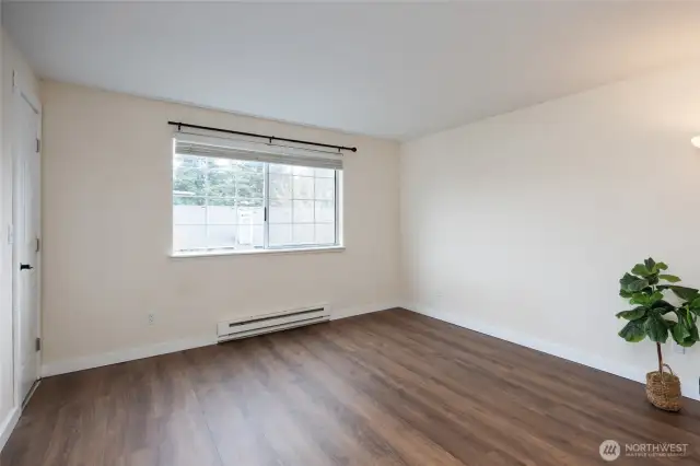 Spacious Primary suite includes a walk-in closet & updated bathroom.