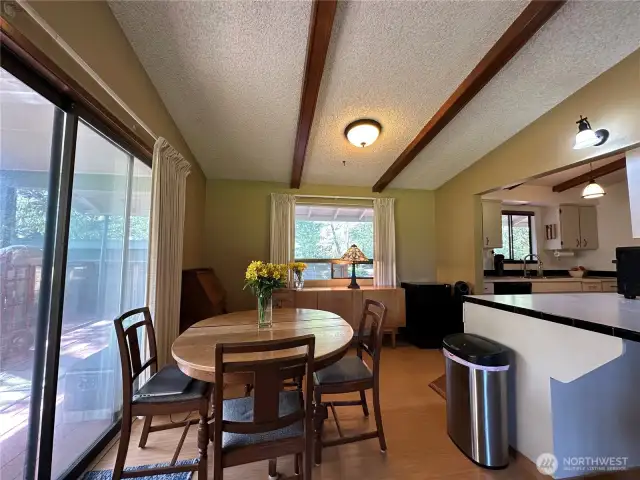 The sliding glass door in the dining room leads to the large deck