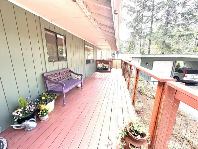 Deck wraps around the end of the house to the golf cours.