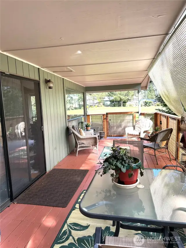 Deck off the kitchen overlooks the green