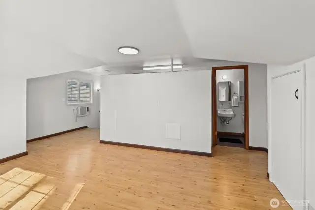 Spacious closets behind the wall next to the half bath.