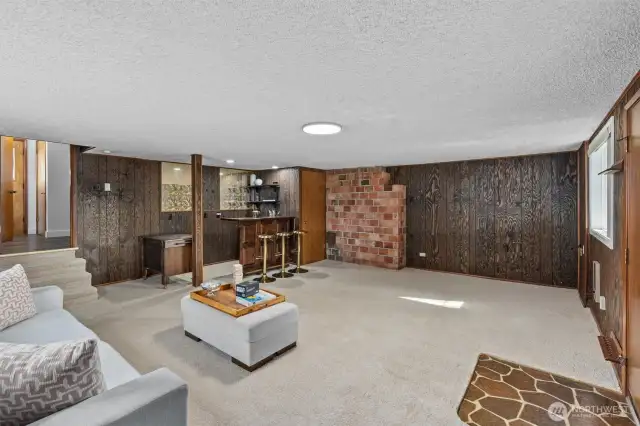 Charming mid-century tile leads out to spacious, multi-function backyard.