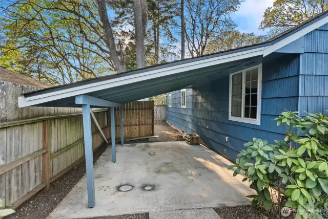 Covered outdoor storage attached to shop.