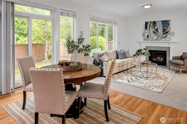 The sunny nook is connected to the family room with a cozy gas fireplace.