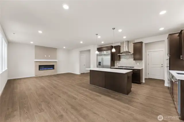 Another great view of the great room from the dining area.  Actual home is under construction and materials, colors, and finishes will vary. See site agent for details.