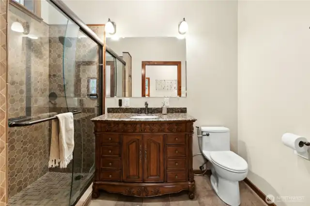 The primary bath features a double spa shower