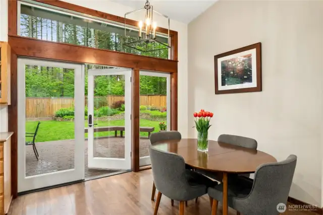 Walls of windows and French door bring in plenty of natural light