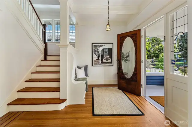 Pretty formal entry with the original wood and beveled glass front door.