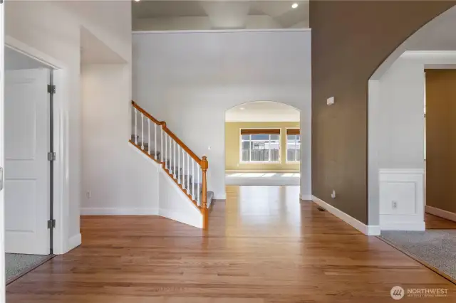 mpressive entry featuring French doors with keyless entry, soaring ceilings, rich wood floors, and open banister stairs. A spacious, deep closet offers bonus wine storage potential. Additional features of the home are a built-in speaker systerm, security system, cameras and more!