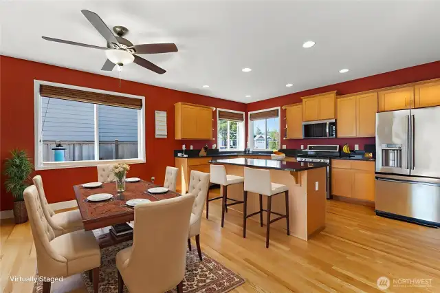 Virtually staged to spark your imagination—this spacious kitchen and eating nook offers endless possibilities. Whether it’s a large dining table for gatherings, a cozy breakfast spot, a creative craft corner or work-from-home setup, plus seating at the center island—there’s room to personalize the space to suit your lifestyle.