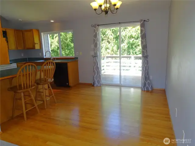 Dining Room With Deck Off The Slider. Oak Hardwood Flooring.