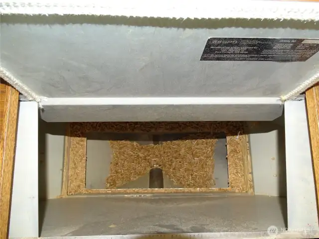 Extra Large Pellet Hopper. Opens At The Top Of The Surround.