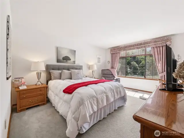 Primary Bedroom with a Pond View