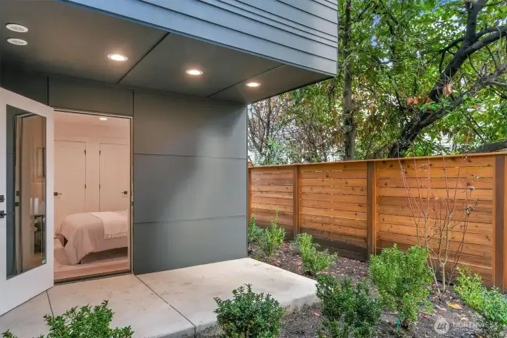 rear Patio and private yard off of lower bedroom / office