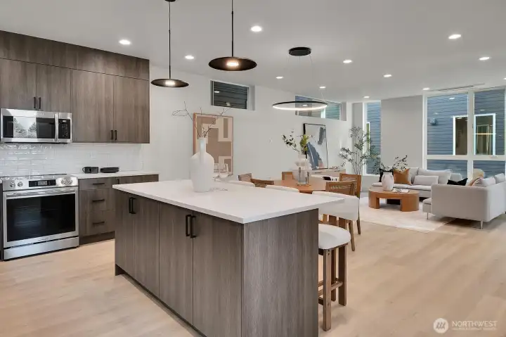 Light engineered hardwood floor tones and modern lighting create an warm inviting paletet to decorate to your own taste