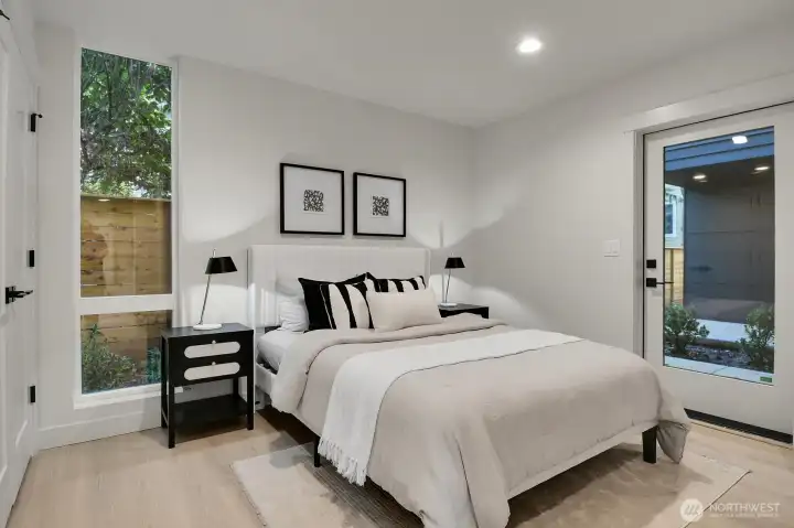 Ground level bedroom or study with double wardrobe closet and door to exterior patio