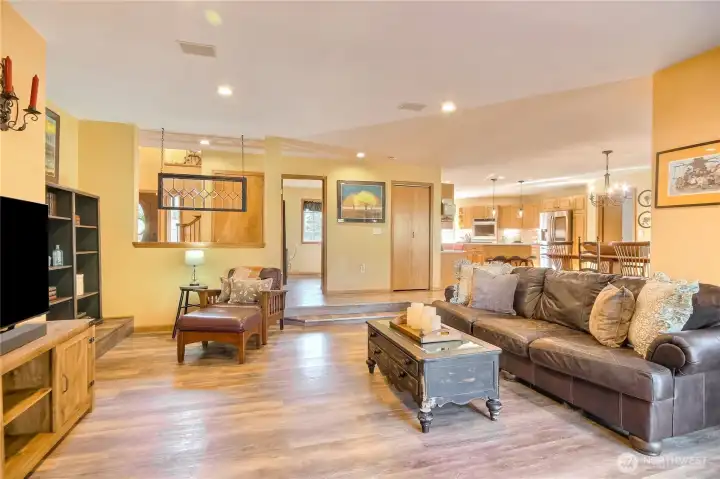 Sunken in living room with wood burning fireplace.