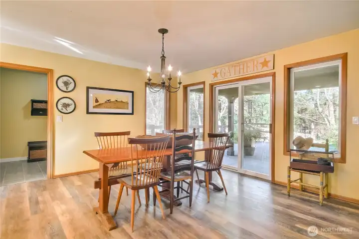 Dining room off of kitchen opens up to backyard.