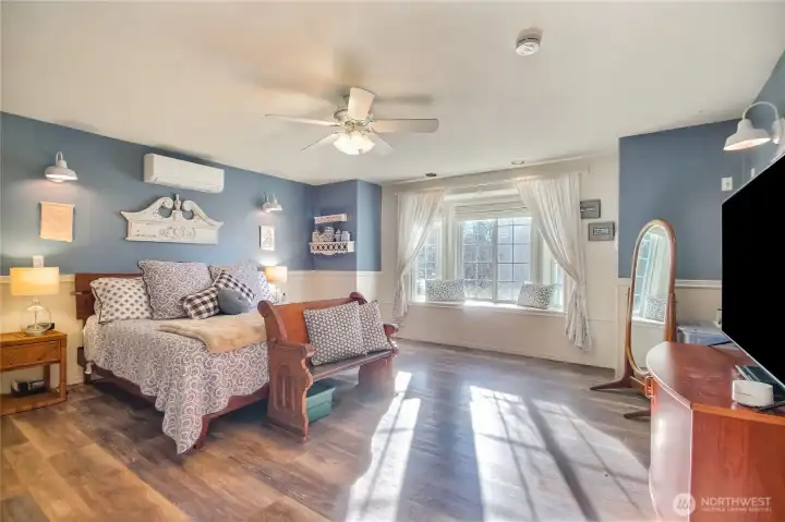 Large primary bedroom with en-suite and built-in window seat.