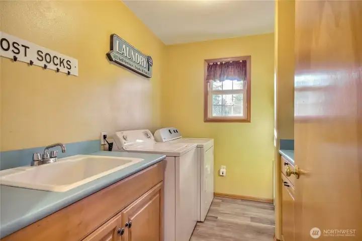 Laundry room with a half bath and mudroom are off the kitchen.