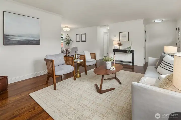 Living area flowing seamlessly into dining room.
