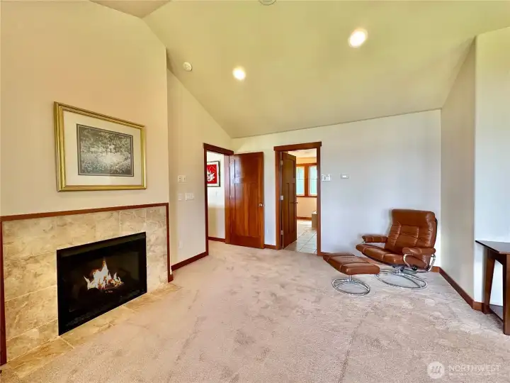 Relax by the fireplace in the second floor primary bedroom.