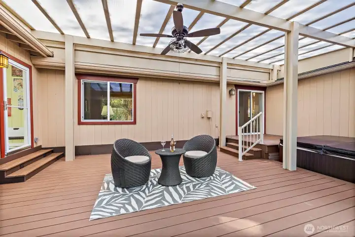 Just off the entertainment/sunroom is an expansive UV protected covered deck.  Don't forget the hot tub!