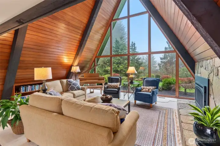 Cozy double sided fireplace can also be viewed from the kitchen.