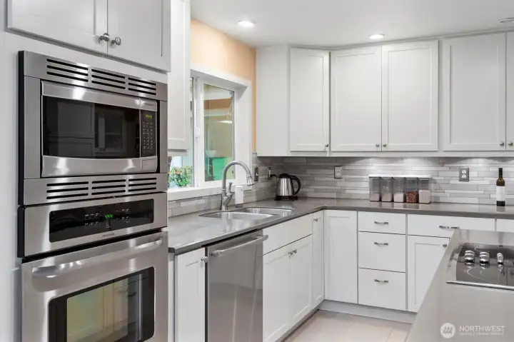 Updated kitchen with stainless steel and lots of storage.