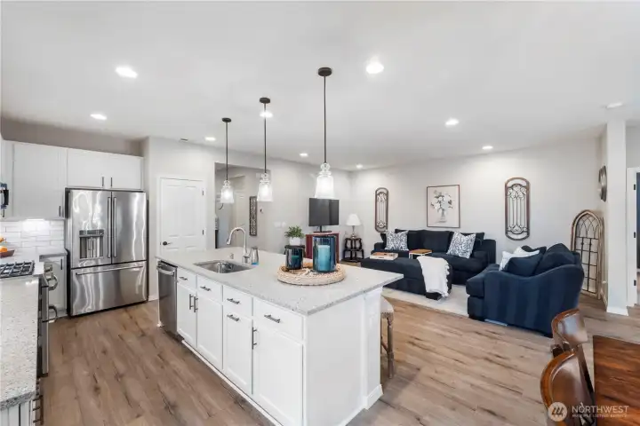 You'll love to cook and serve with this wonderful island as your centerpiece. Plenty of quartz counter space, and the upgraded OVERSIZED sink will accommodate any pan, tray or cooking utensil.