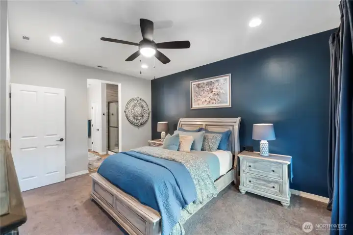 Owner's suite is truly SWEET - with overhead fan (yes, that's ANOTHER upgrade), spacious bathroom (with closeted thrown room), and nice plush carpeting. Tucked in the back of the home, it overlooks the lovely backyard.