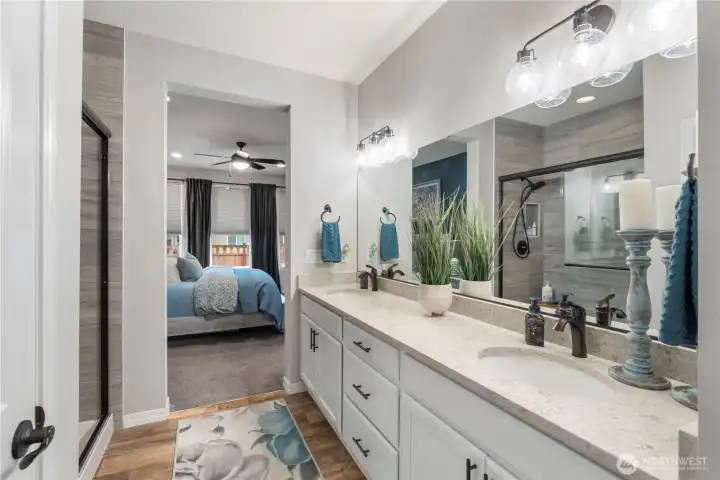 Oil-rubbed bronze hardware (sink fixtures, cabinet and drawer pulls, door handles and more) provide quality and just-right contrast to this bright white and natural wood toned decor throughout. REMINDER: nice bright bedroom comes stocked with blinds, sheers and black-out curtains, too.