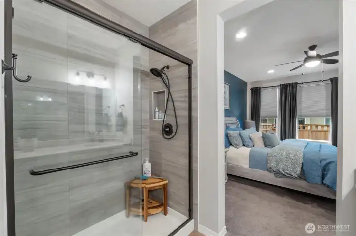 Tiled shower with recessed shampoo niche is another plus. So many extras and upgrades in this home!
