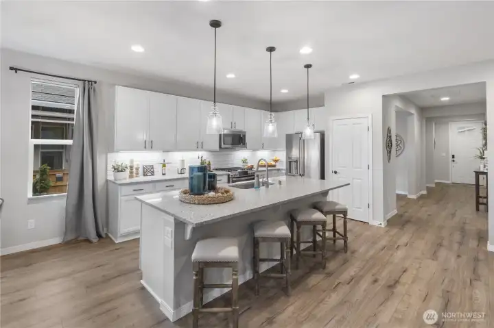 So many upgrades and owner improvements! Oil rubbed bronze hardware, extended (tall) upper cabinets, pull out shelves EVERYWHERE, undermount lighting, pretty pendant lights over the counter, electricity in the island, and much more!