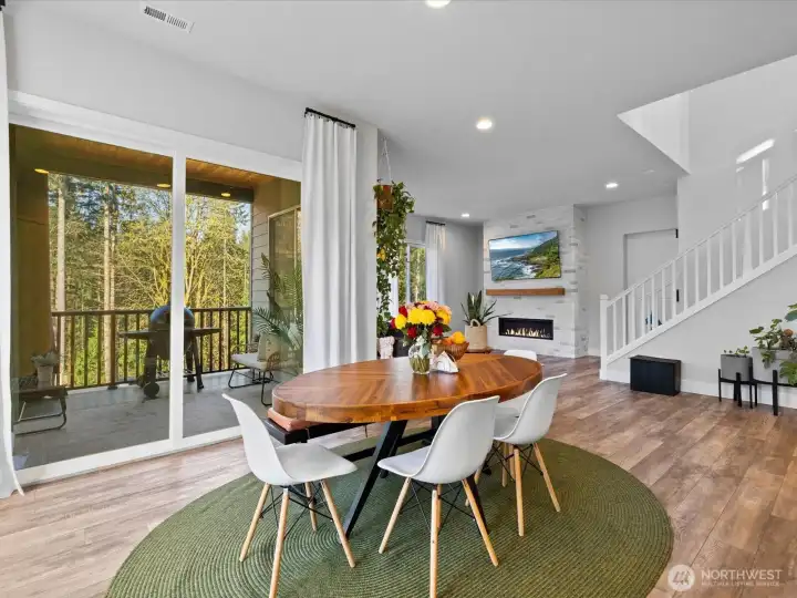 Just off the kitchen is a dedicated dining space with a sliding door to the covered patio.