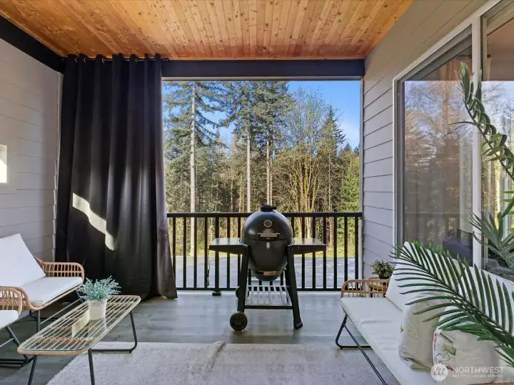 The covered patio just off the kitchen provides year-round comfort.