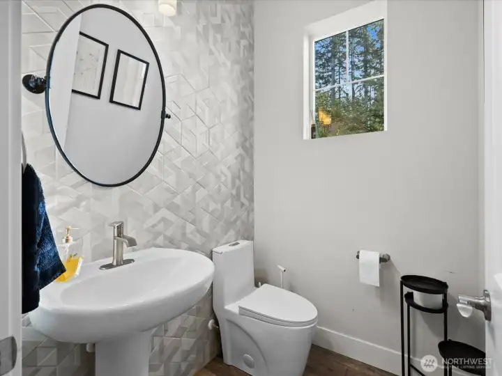 The main level features a convenient half bath just off the entry.