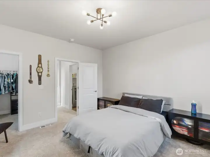 Second bedroom located on the upper level is spacious and bright.