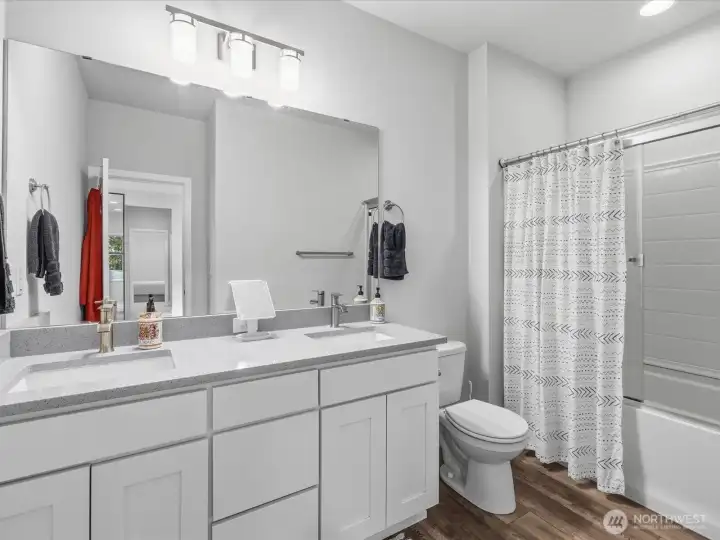 A full bathroom on the upper level is shared by the second, third, and fourth bedrooms.