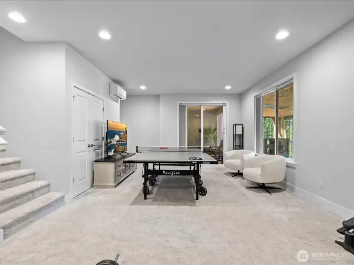 A spacious rec room with access to the patio.