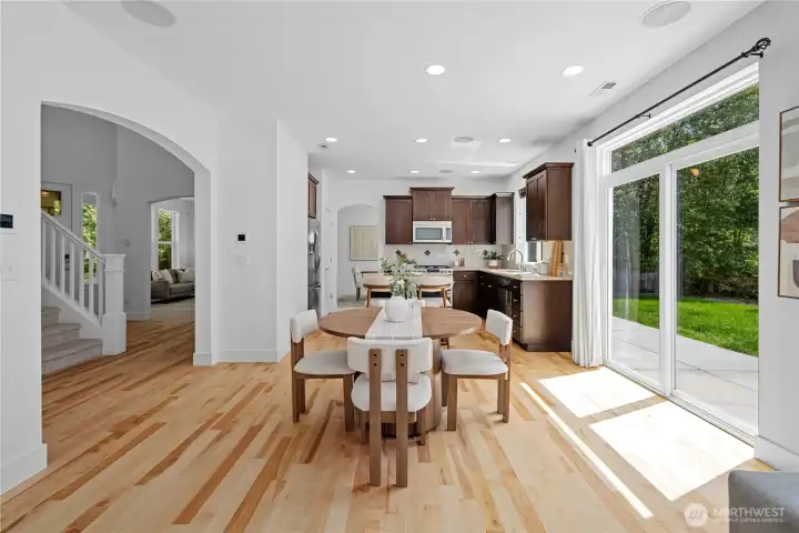 An easy circular flow carries you through the main floor, from the kitchen and dining nook to the family room, foyer, and formal living spaces, with each room opening naturally into the next. Beautifully refinished birch floors continue throughout, and fresh paint in one bright, cohesive color brings the whole home together with a calm, connected feel.